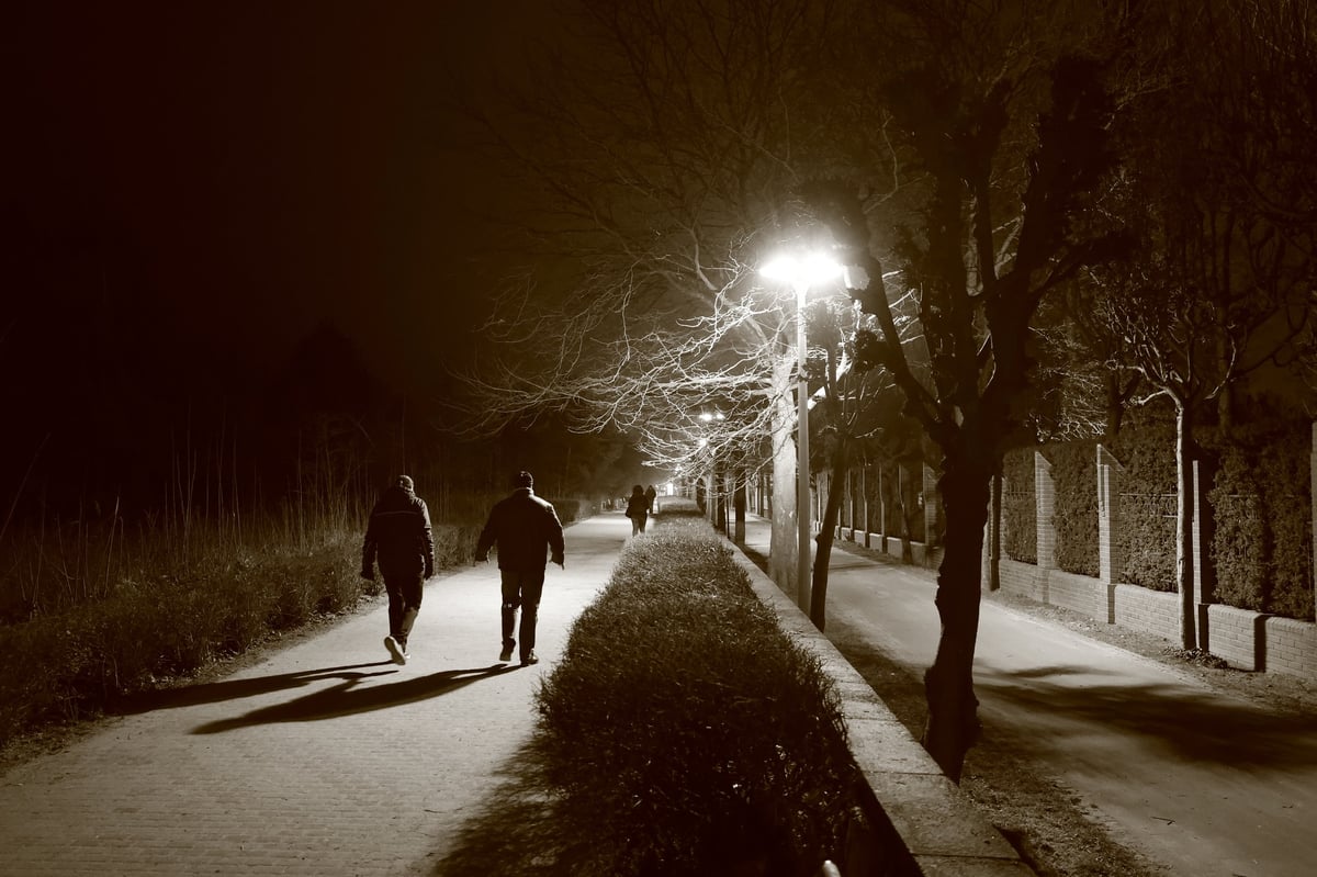 Men walking at night